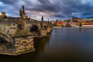 Famous iconic image of Charles bridge at sunset in spring, Prague, Czech Republic. Concept of world travel, sightseeing and tourism.