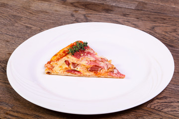 Pizza with ham and sausages