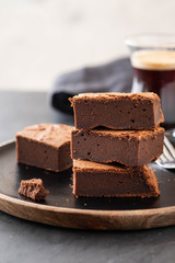 Double Chocolate Brownies. Homemade chocolate fudge brownies with chocolate chips and black background. Copy space.