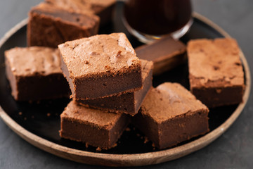 Double Chocolate Brownies. Homemade chocolate fudge brownies with chocolate chips and black background. Copy space.