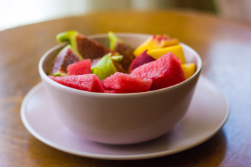 Trendy pink buddha bowl of fruit salad