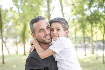 Fototapeta premium Young father posing with his children
