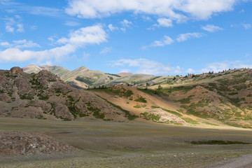 Landscape with sunspots on the hills.
