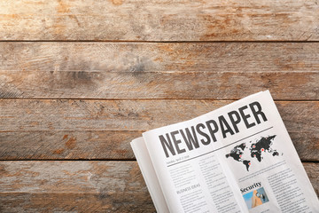 Newspapers on wooden background