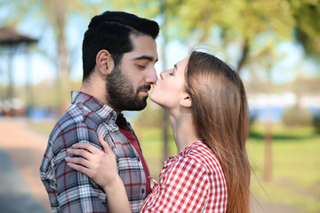 Fototapeta premium Happy young couple in park on spring day