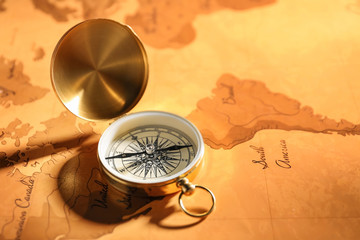 Vintage compass on world map