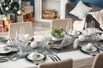 Table served for Christmas dinner in living room