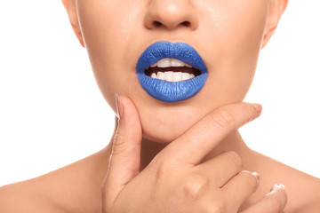 Obraz premium Beautiful young woman with unusual lipstick on white background, closeup