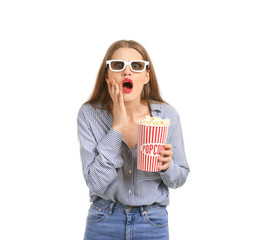 Obraz premium Emotional young woman with cup of popcorn and 3D cinema glasses on white background