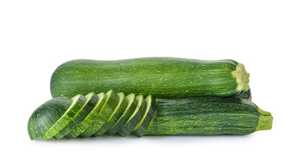 Ripe zucchinis on white background