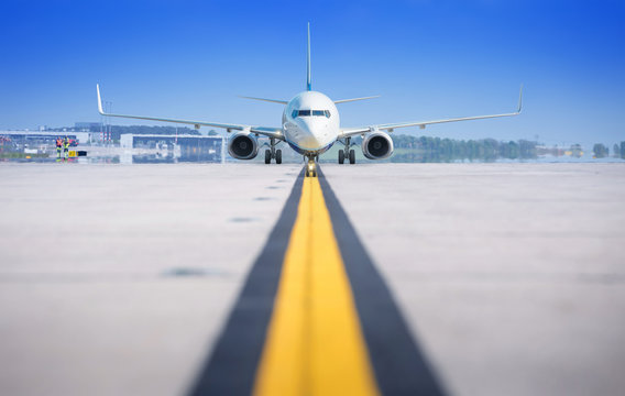 Fototapeta modern airliner on a runway