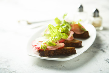 Pickled radish salad on toast