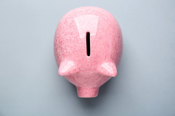 Piggy bank on grey background