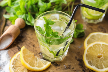 Glass of fresh mojito on metal tray