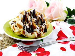 freshly sweet waffles on a tablecloth background