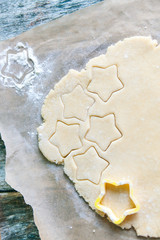 Cutting out star shapes for homemade Christmas cookies