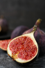 Fresh ripe figs on grey table