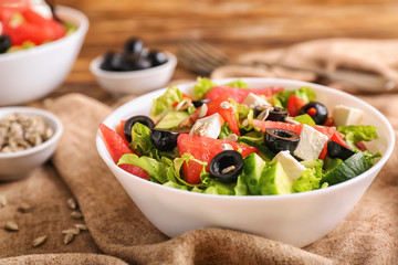 Bowl with delicious watermelon salad on table, closeup