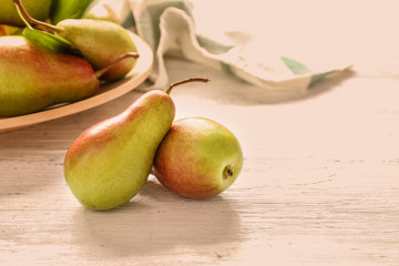 Ripe pears on wooden table