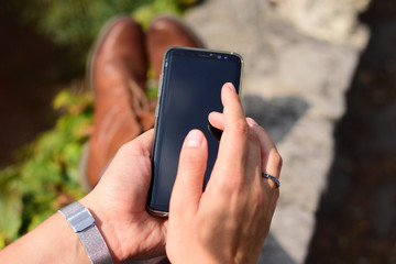 Woman outside with cellphone