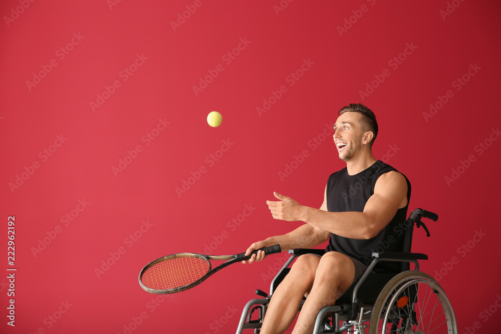 Sticker Young tennis player sitting in wheelchair on color background