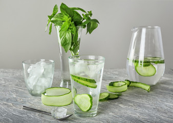 Glassware of fresh cucumber water on light table