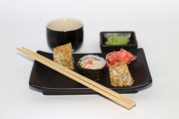  isolated sushi on a plate with wasabi and soy sauce