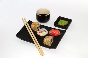  isolated sushi on a plate with wasabi and soy sauce