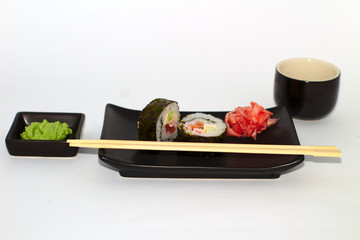  isolated sushi on a plate with wasabi and soy sauce