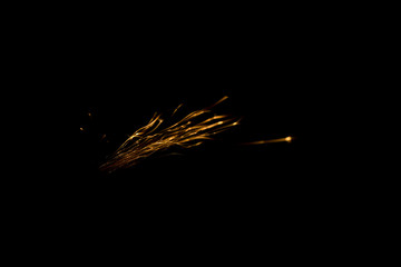 a bunch of fiery sparks on a black background