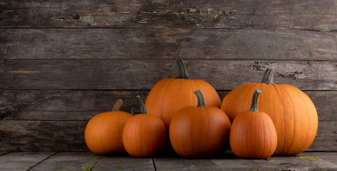 Pumpkins on wooden background