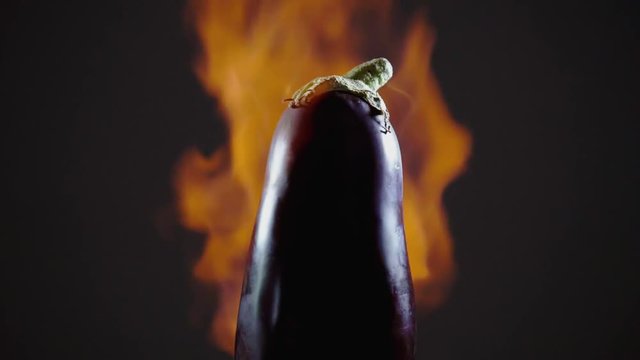 Eggplant fire-roasted on flame