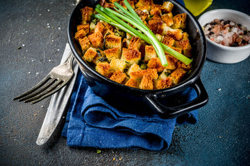 Traditional Thanksgiving, Christmas stuffing in baking pan, dark blue concrete background top view copy space