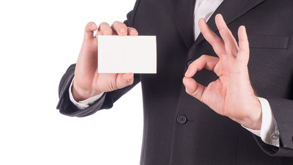 Businessman showing blank business card isolated on white background.