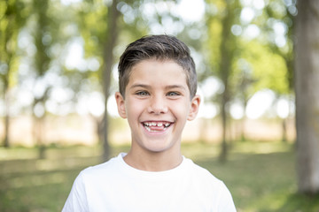 Handsome child posing in the park