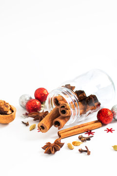 Holiday Food background Christmas spices Star anise, cloves and cadamon pods on white background