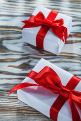 Set of red wrapped present boxes on wooden surface
