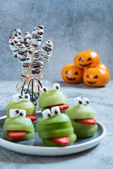 Spooky green kiwi monsters for Halloween