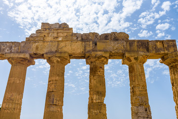 Fototapeta premium Ruins of the doric Temple of Hera (Temple E) inside the archaeological park of Selinunte, an ancient Greek city on a seaside hill in the south west coast of Sicily.