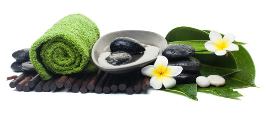 spa objects with towel and stones for massage therapy
