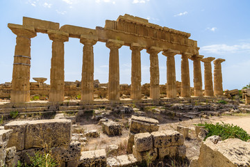 Obraz premium Ruins of the Temple C dedicated to Apollo, inside the archaeological park of Selinunte, an ancient Greek city on a seaside hill in the south west coast of Sicily.