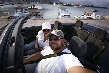 Summer car and two lovers in port 