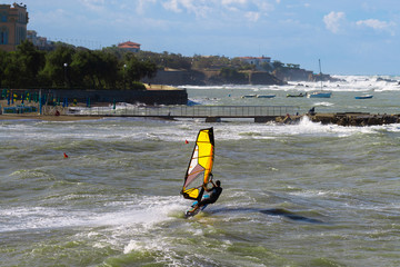 Sea Waves and Wind Surfing in the Summer in Windy Day