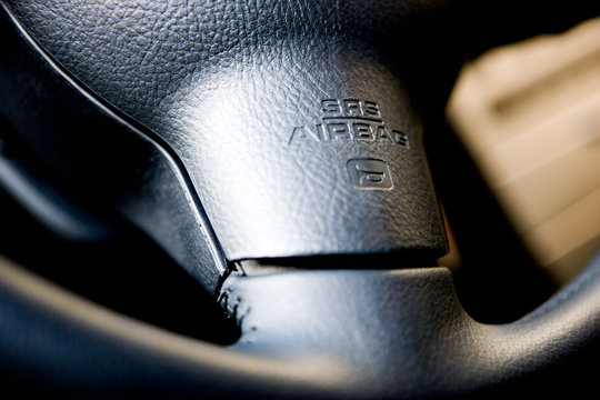 Closeup of wheel with airbag letters
