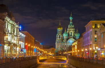 Fototapeta na wymiar Beautiful nightscape of Church of the Savior on Spilled Blood over Griboyedov canal at twilight, St Petersburg, Russia