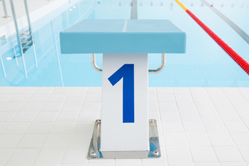 Swimming pool with starting block. Sport facility. Front view. Close up.