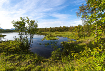 The beautiful lake in autumn paints. Tromso. Prestvann