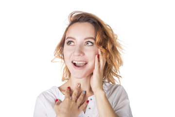 Beautiful young surprised woman isolated on white.