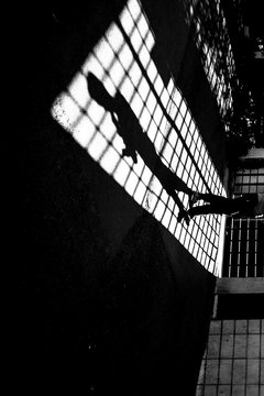 Silhouette walking at grid
