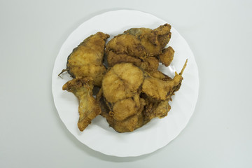 Top view of fried fish in white plate. fried seafood.